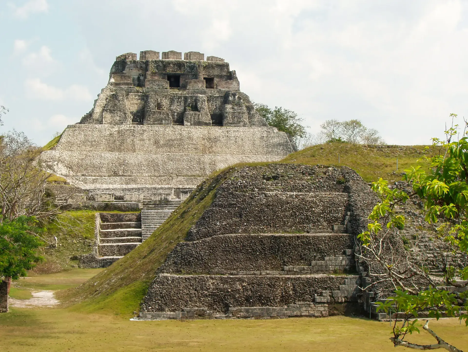 Ancient Maya ruins surrounded by greenery